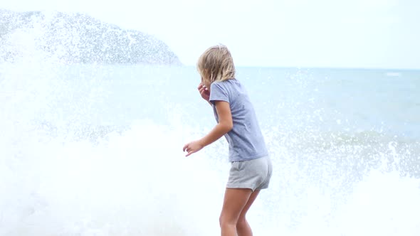 Child on the Seashore During a Light Storm