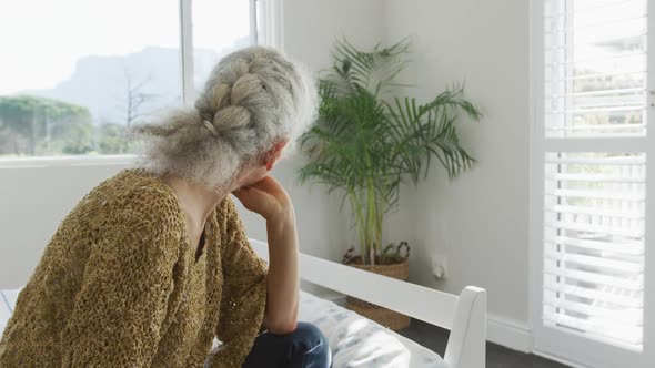 Animation of caucasian senior woman feeling bad, having headache alt