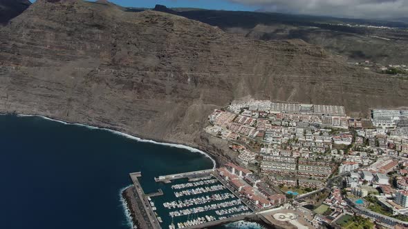 Aerial view of Los Gigantes coastal town in Tenerife, Canary Islands, Spain alt