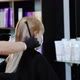Hands of a hairdresser in rubber hair blow dry a blonde - VideoHive Item for Sale