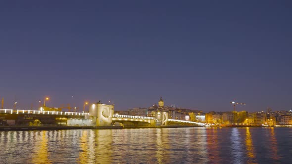 Evening harbor in lights and with many passing boats alt