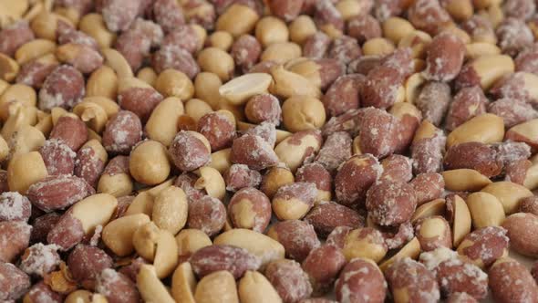 Arachis hypogaea snack on pile  4K 2160p 30fps UltraHD tilting footage - Popular salted and roasted  alt