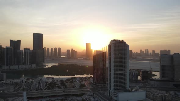 Sunset in Abu Dhabi Aerial View on Al Reem Island Surrounded By Modern Skyscrapers Between the alt