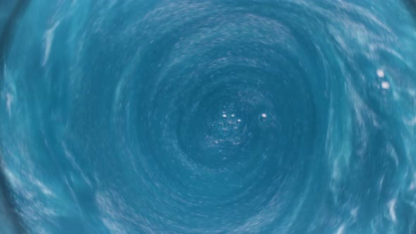 Blue unusual champagne with shining particles alt