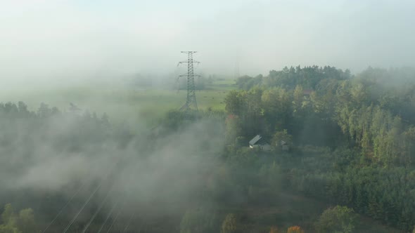 Flight Along High Voltage Power Lines and High Voltage Electric Transmission Tower or Pylon on the alt
