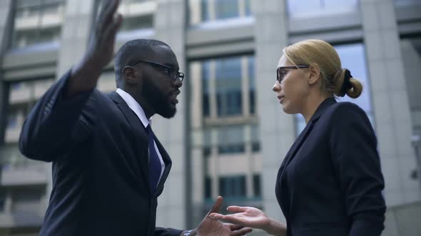 Male Boss Scolding Subordinate, Employee Justifying Herself, Business Ethics alt