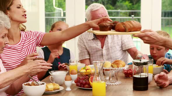 Happy Family having Breakfast Together alt