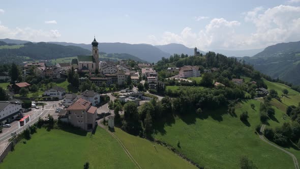 Aerial drone video of the city of Völs am Schlern Fie allo Sciliar  on the Italian Alps Dolomites alt