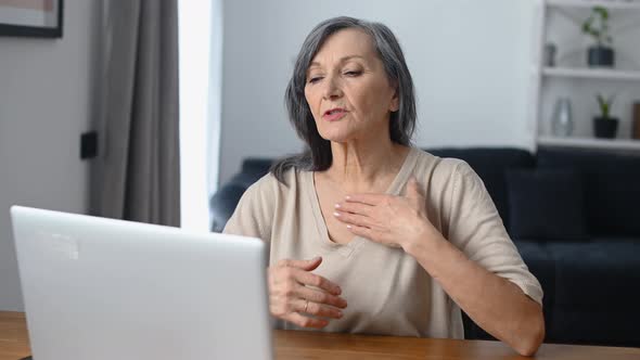 Middleaged Woman Using Laptop alt