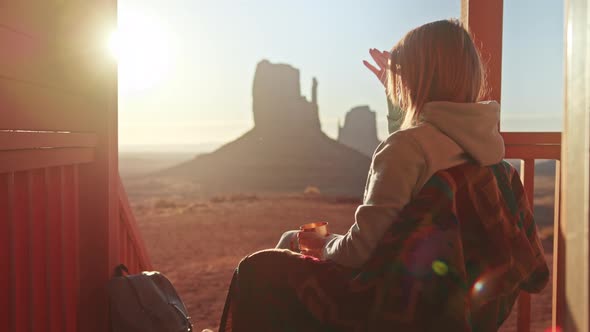 Slow Motion Woman Having Good Time on Cabin Terrace Looking at Golden Sunrise alt