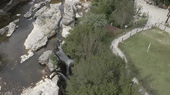 Aerial view of Martvili canyon. Blue water in fresh cold mountain river at sunny summer morning alt