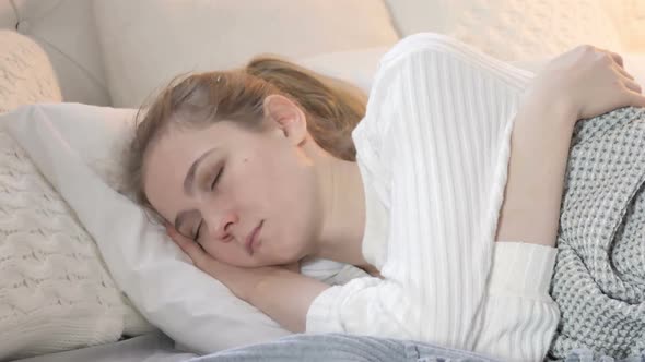 Young Woman Sleeping in Bed alt