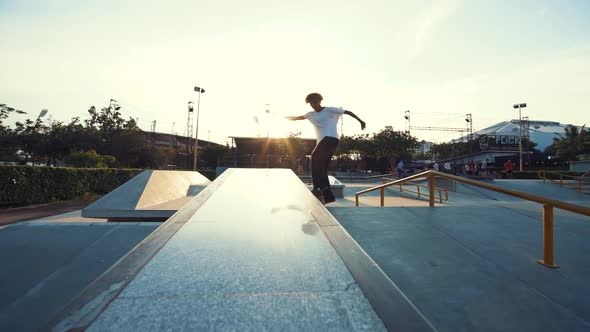 Young Man Skateboarding At Sunset