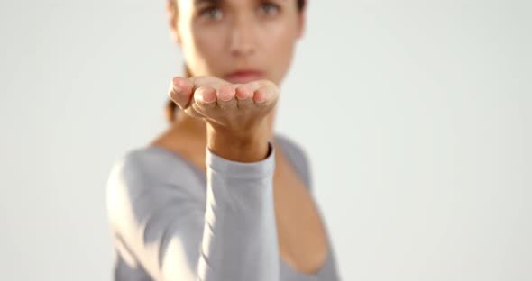 Woman gesturing on white background alt