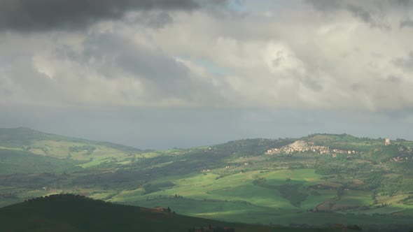 Shadows of Clouds Slide on Hills of Tuscany, Italy alt