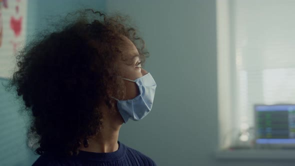 Physician Preparing Vaccine Injection for African American Girl in Hospital alt