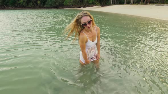 The Pretty Girl Dances an Burning Erotic Dance in White Dress in Grid alt