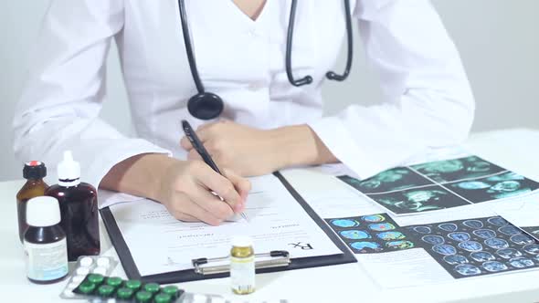 Doctor Fills The Medical Form For The Prescription