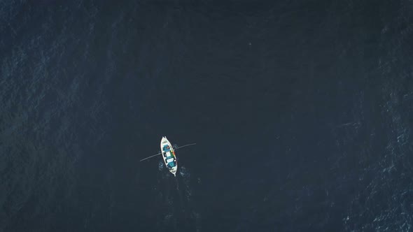 Aerial View Of Small Fishing Boat On The Ocean