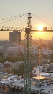 Construction Crane in the City at Sunrise alt