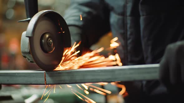 Angle Grinder Cutting Metal at Workshop alt