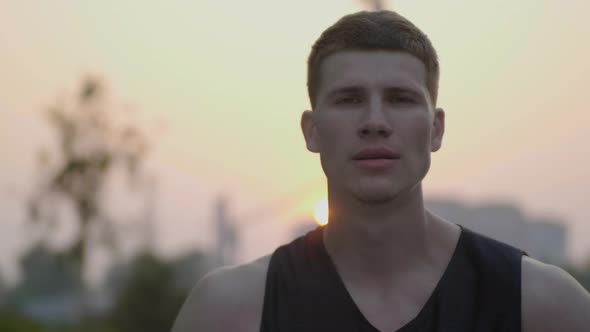 Basketball Player Looking To Camera and Smiling alt