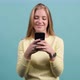 Young Happy Woman Using Smartphone. Excited Surprised Girl Texting on Her Phone. - VideoHive Item for Sale