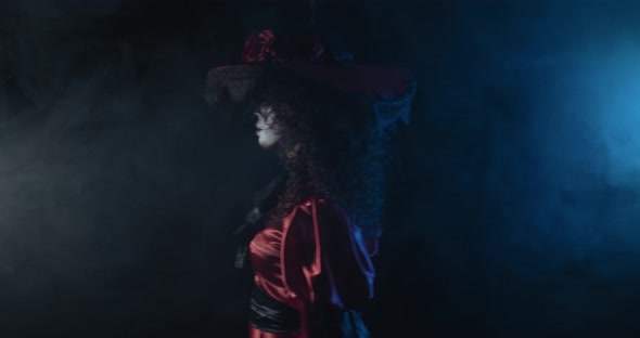 Young Woman in Red Dress Is Walking Big Hat Scary Film Grain alt