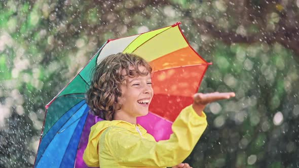 Happy Child Playing in the Rain