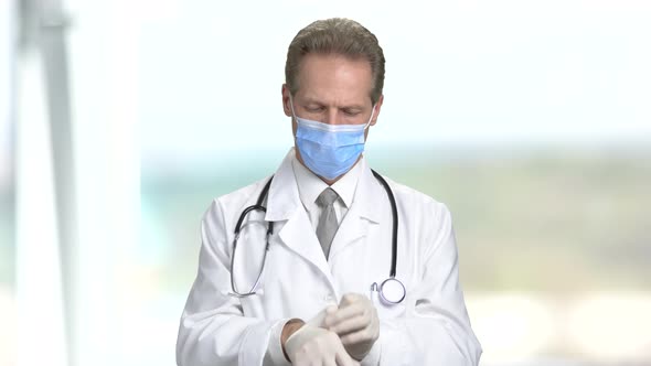 Doctor Put on Gloves and Fold Hands alt