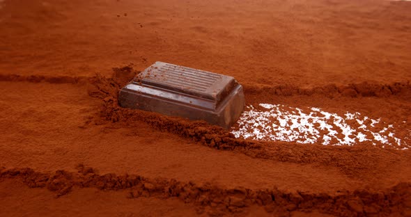 Chocolats Sliping on Black Chocolate Powder, Slow Motion 4K alt