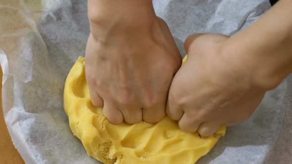 making desserts: working the fresh dough with hands alt