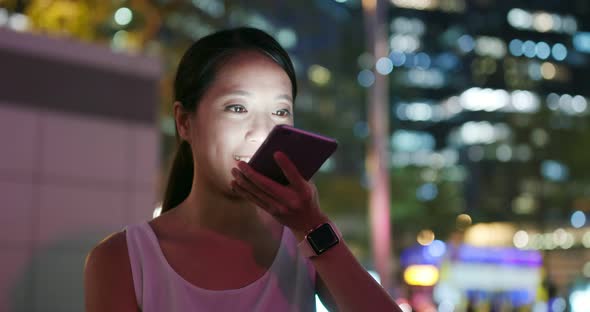 Woman use of cellphone at night alt