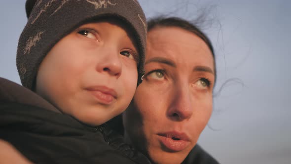 Cute Sad Boy is Crying Mom is Kissing Her Trying to Calm the Child alt