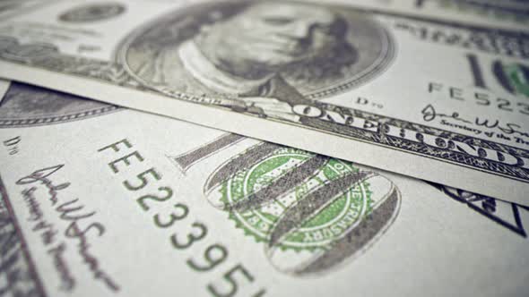 American One Hundred Dollar Paper Banknote Pile on Office Desk alt