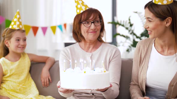 Mother, Daughter, Grandmother with Birthday Cake alt