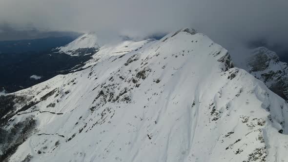 Drone View of the Slopes of the Black Pyramid Mountain in Winter Covered in Snow alt