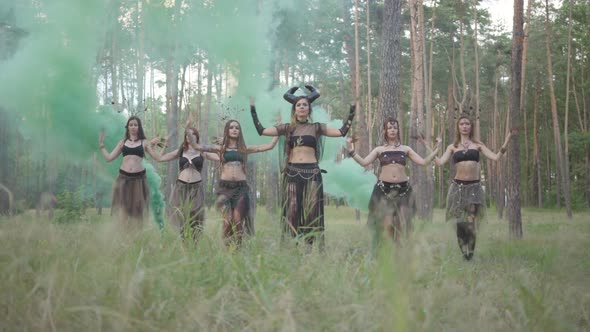 Group of Women Dancers with Make-up and in Mystical Fabulous Costumes Dancing Groovy Dance in Color alt