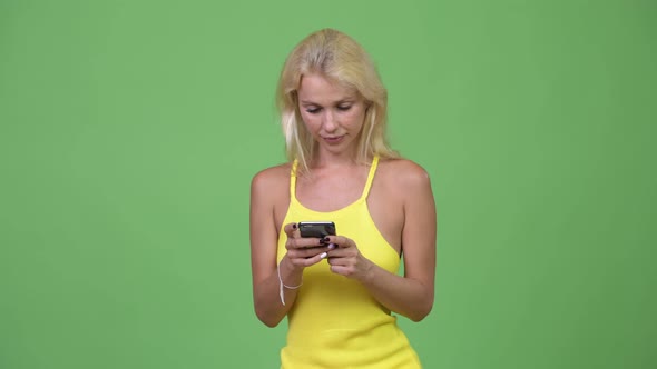 Young Happy Beautiful Blonde Woman Using Phone