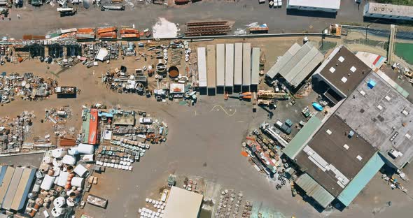 Aerial view industry recycle old machine technician separate classification part of irons metals alt