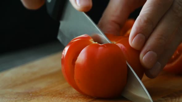 Cutting Tomato By Culinary Knife. Slow Motion