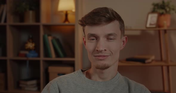 Close Up View of Millennail Handsome Man Turning Head and Looking To Camera alt