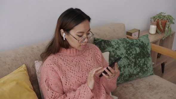 Middle Eastern Young Woman Using Smart Phone Surfing Social Media Playing Mobile Games Checking News alt