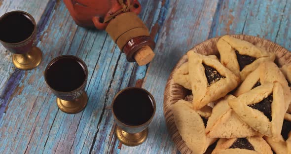 Jewish Carnival Purim Celebration on Hamantaschen Cookies Noisemaker and Mask with Parchment alt