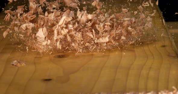 Wood Chips Falling on a Board, Slow Motion 4K alt