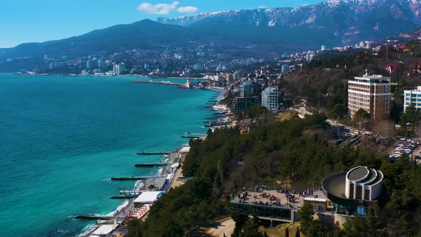 The Seaside and the Coastal Town Overlooking the Mountains