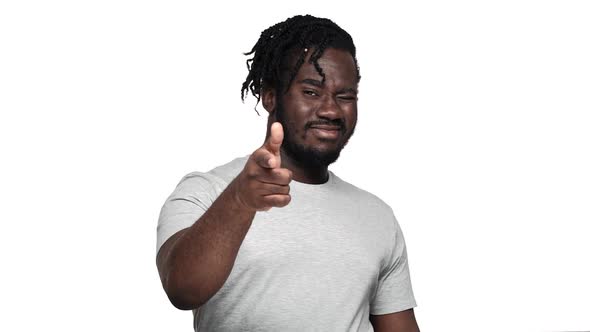 Portrait of Handsome Muscular African Man Wearing Pigtails and Mustache Gesturing at Camera Index alt