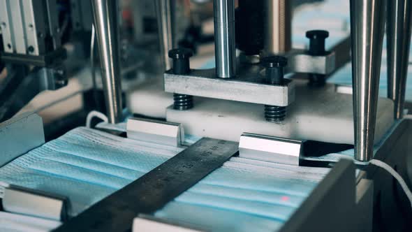 Face Mask Earloop Attaching Machine in Action. Covid-19 Medical Protection Mask alt