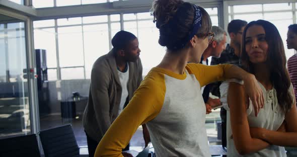 Executives interacting in office alt