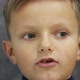 Closeup Shot of a Little European Boy Who Says Something Interesting Looks Funny - VideoHive Item for Sale